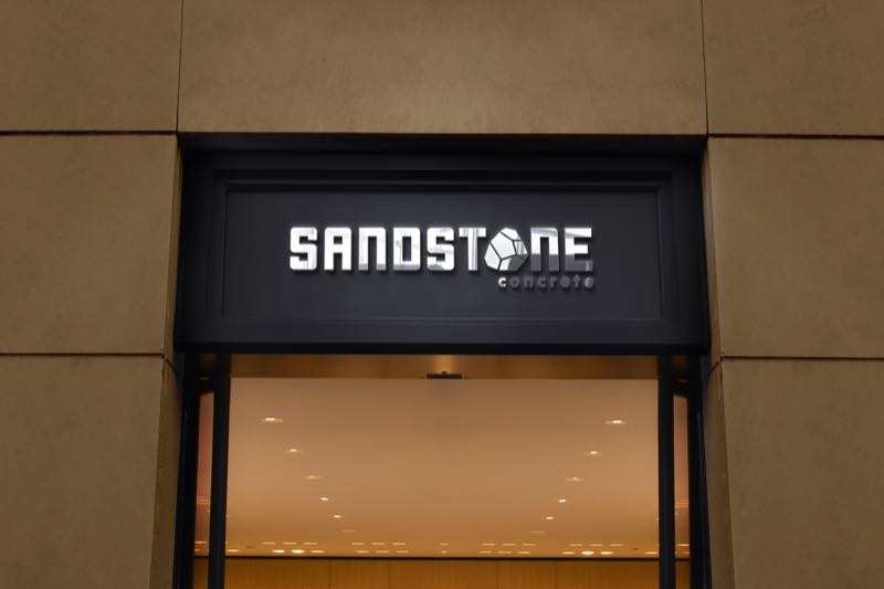 Sandstone illuminated storefront signage